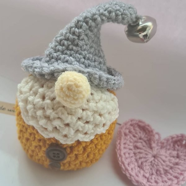 Mustard crochet gnome with bell topper